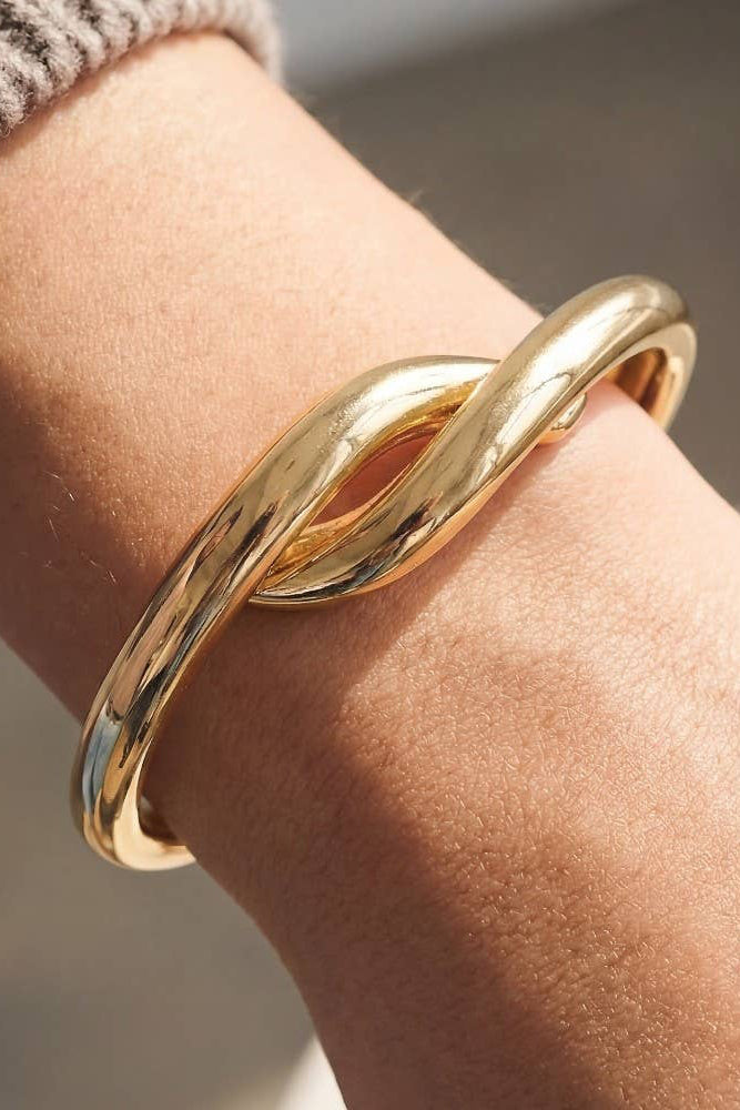 The Metallic Twist Clasp Bangle Bracelet